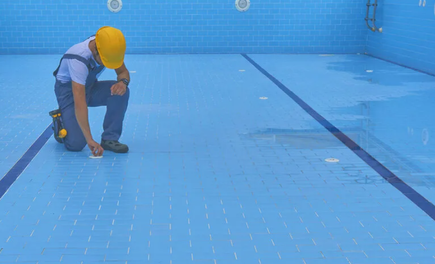 Pool water surface with clear tiles and reflection